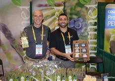 Scott Hulsey and Paul Mortanian with Gourmet Trading Company show asparagus and blueberries. The company is ready to switch to its domestic blueberry season.